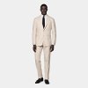 This sand suit is cut to a tailored fit, offering a slim chest and waist for a fitted silhouette and natural shoulders. Paired with straight-leg trousers featuring mid-rise and belt loops.