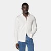 The warmth and comfort of a cardigan meets the relaxed versatility of a polo in this dynamic off-white knit—pair it with a blazer or wear it untucked on its own, it's perfect for any elevated casual occasion.